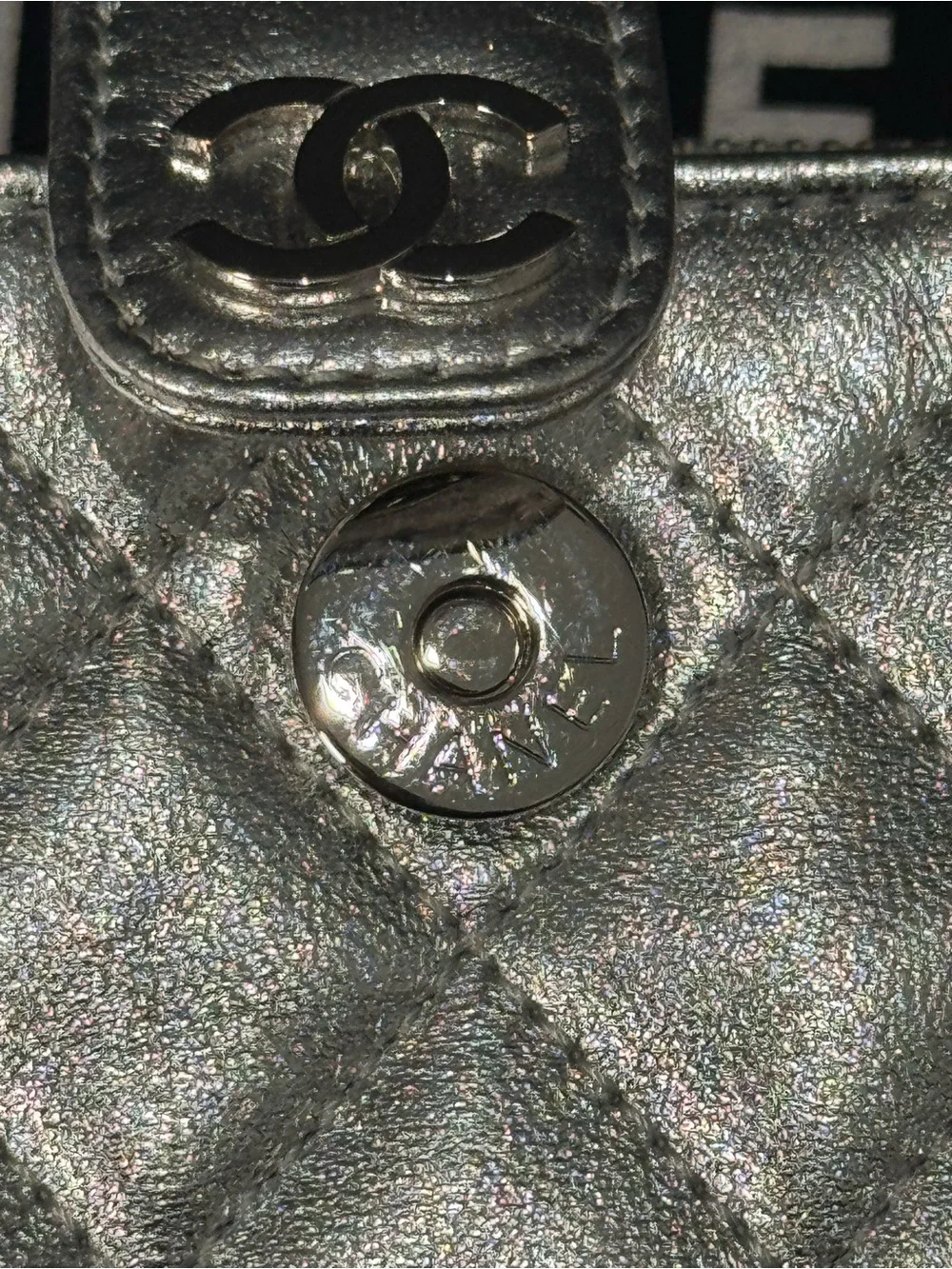 CHANEL Silver Quilted Leather O-Phone Holder with Pearl Chain.